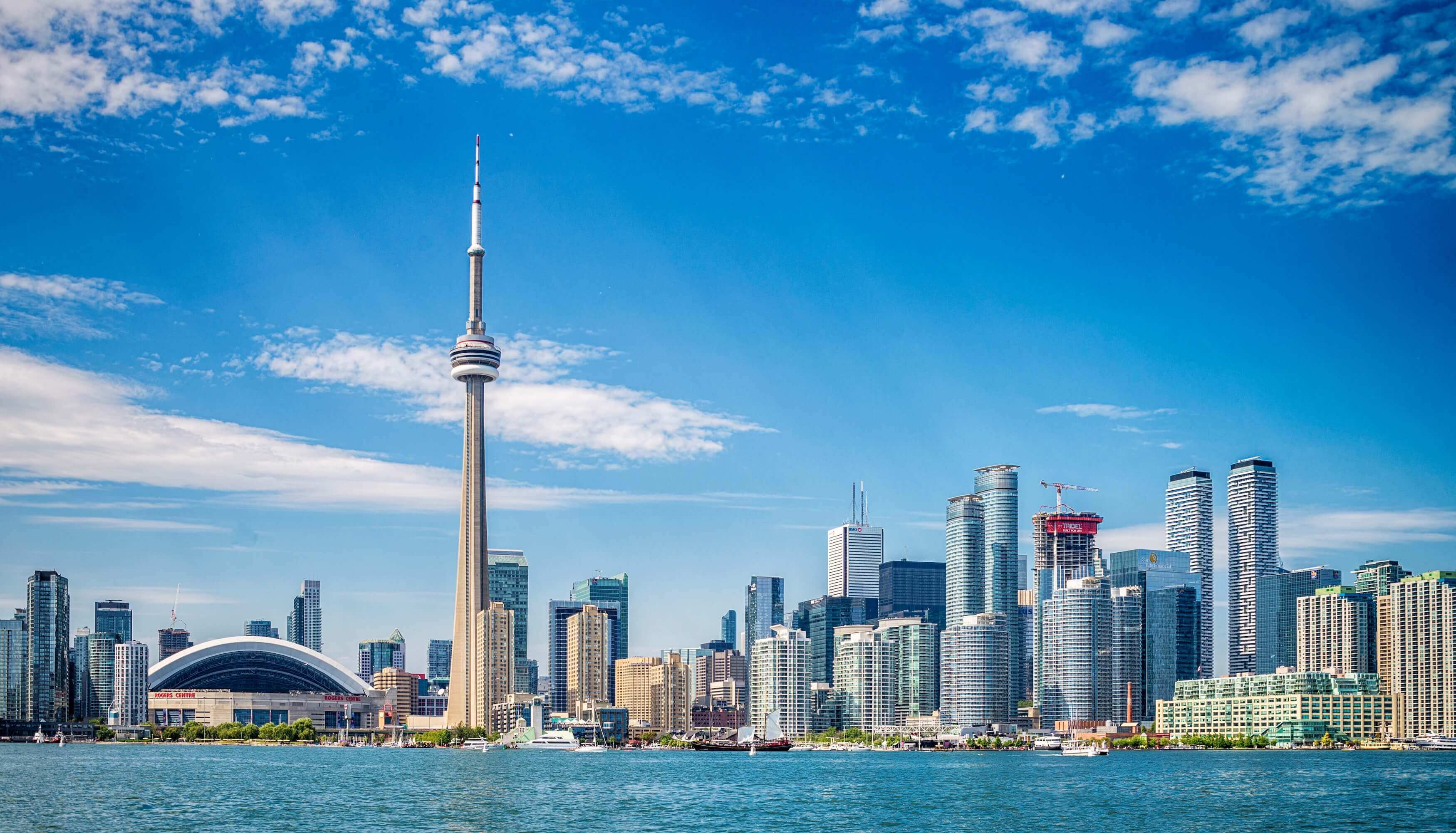 City skyline with prominent tower against a blue sky