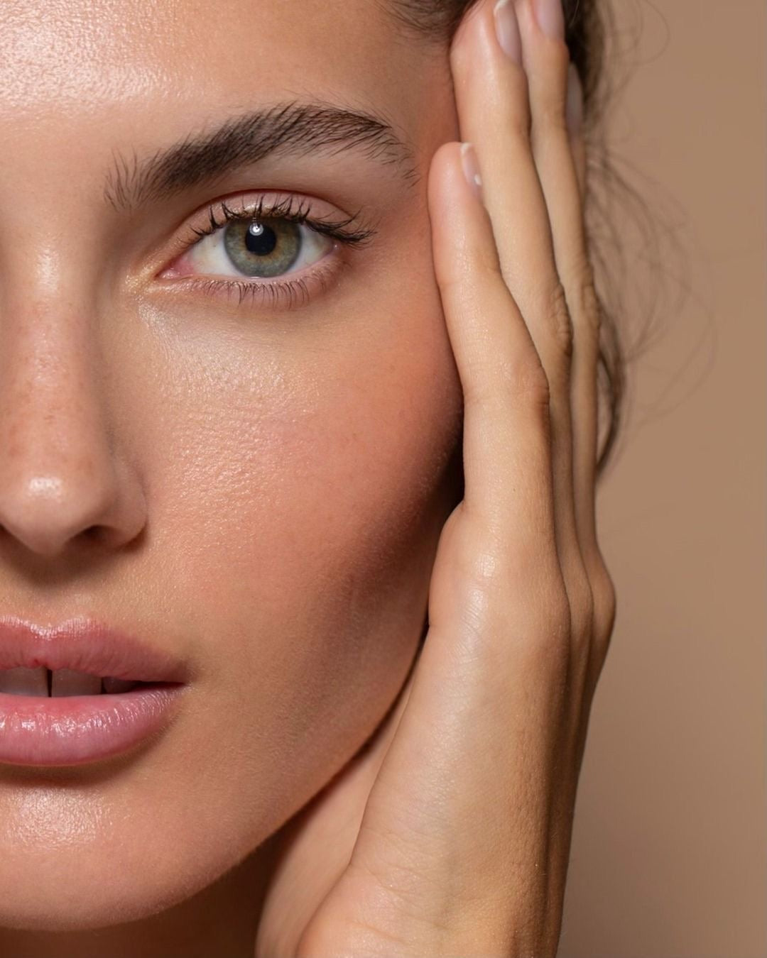 Close-up of a woman with radiant skin and defined features, highlighting smooth texture and facial balance after aesthetic treatment
